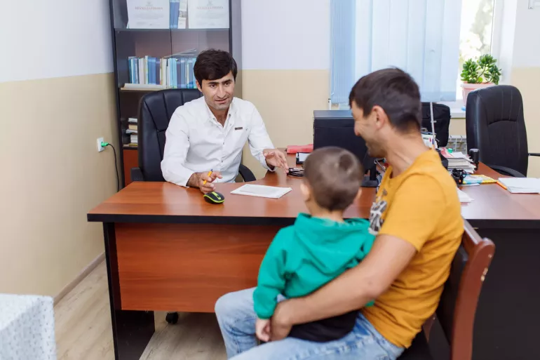 Little Iskandar is brought to the district health center in Khovaling by his father, who is concerned about his son's weight. 
