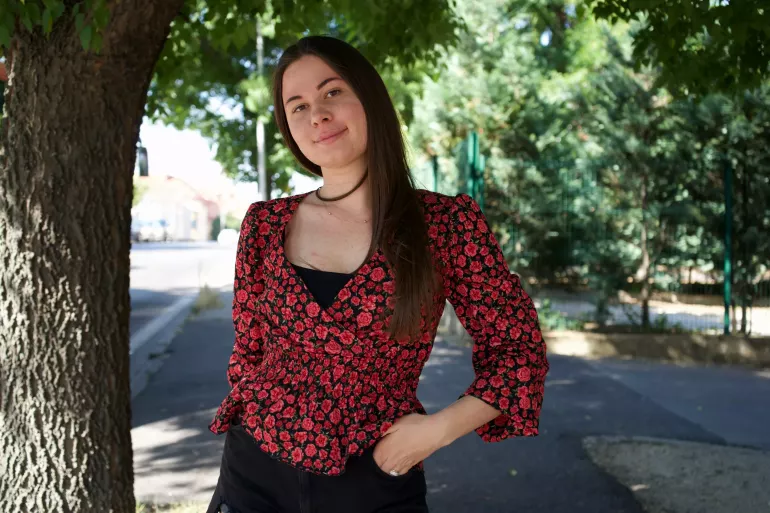 Vladyslava Balera standing on the street in city of Nitra near the community centre COMIN