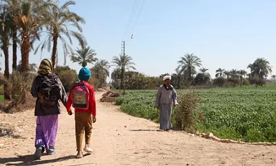 February 2014, A newly built school. Al Zahraa Community School Gehina Destrict, assisted by UNICEF. UNICEF provides school supplies and furnitures and supports teachers' training. Activities documents  in order are story telling,  arabic class, maths, puppet show and art class.  In the image Abdel Baset on his way to school with his older sister.