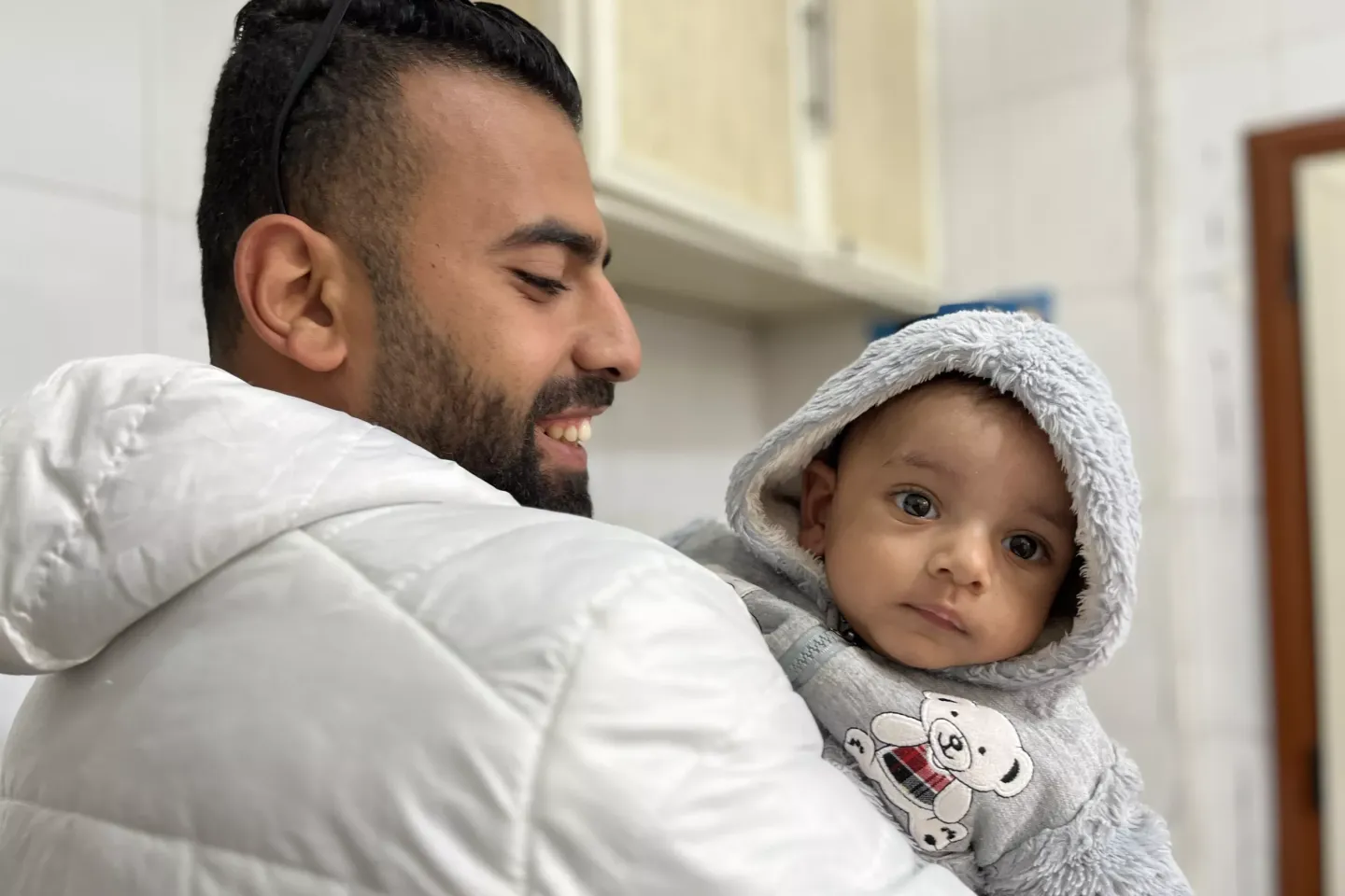 Father holding his baby 