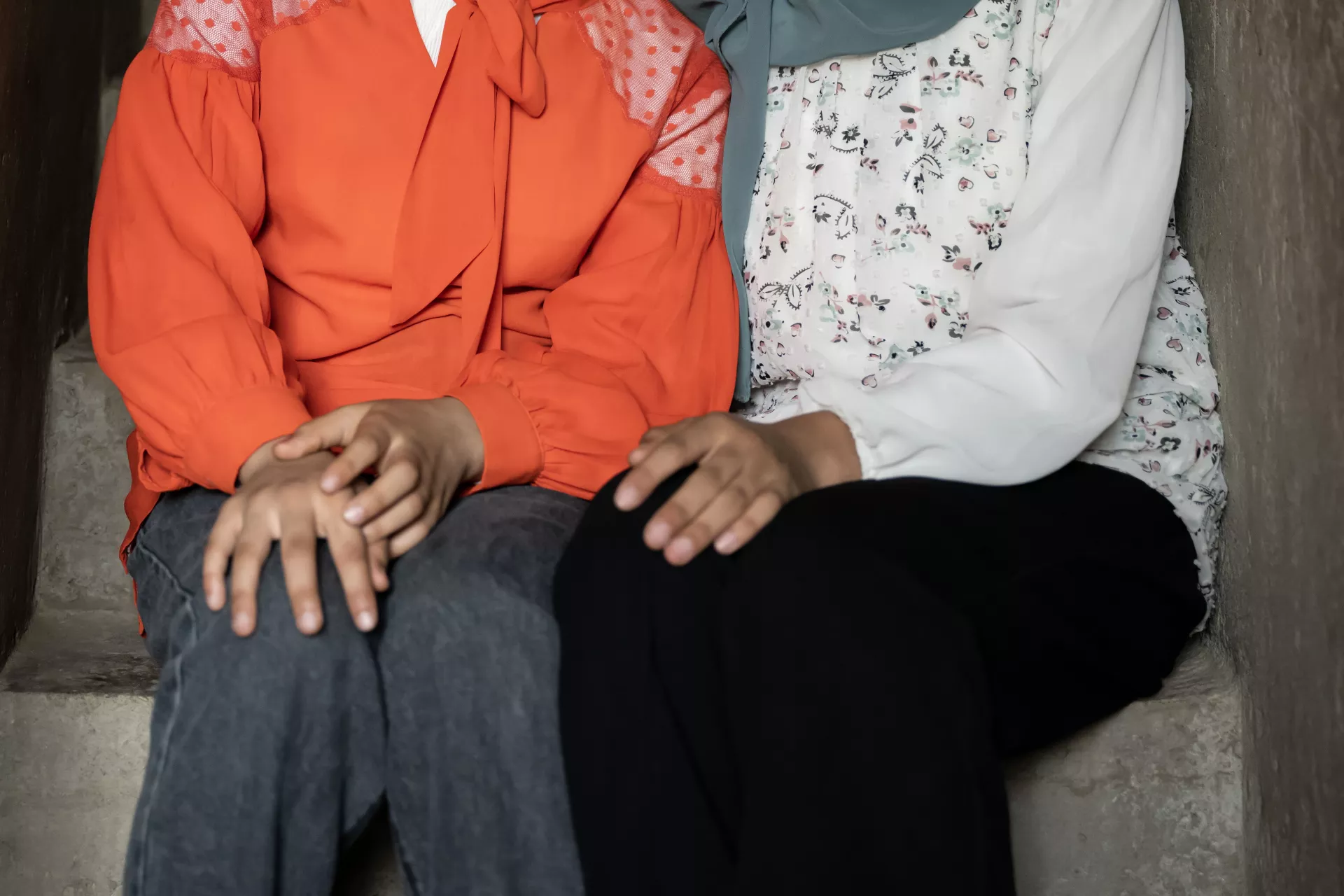 Girl sitting with Mother