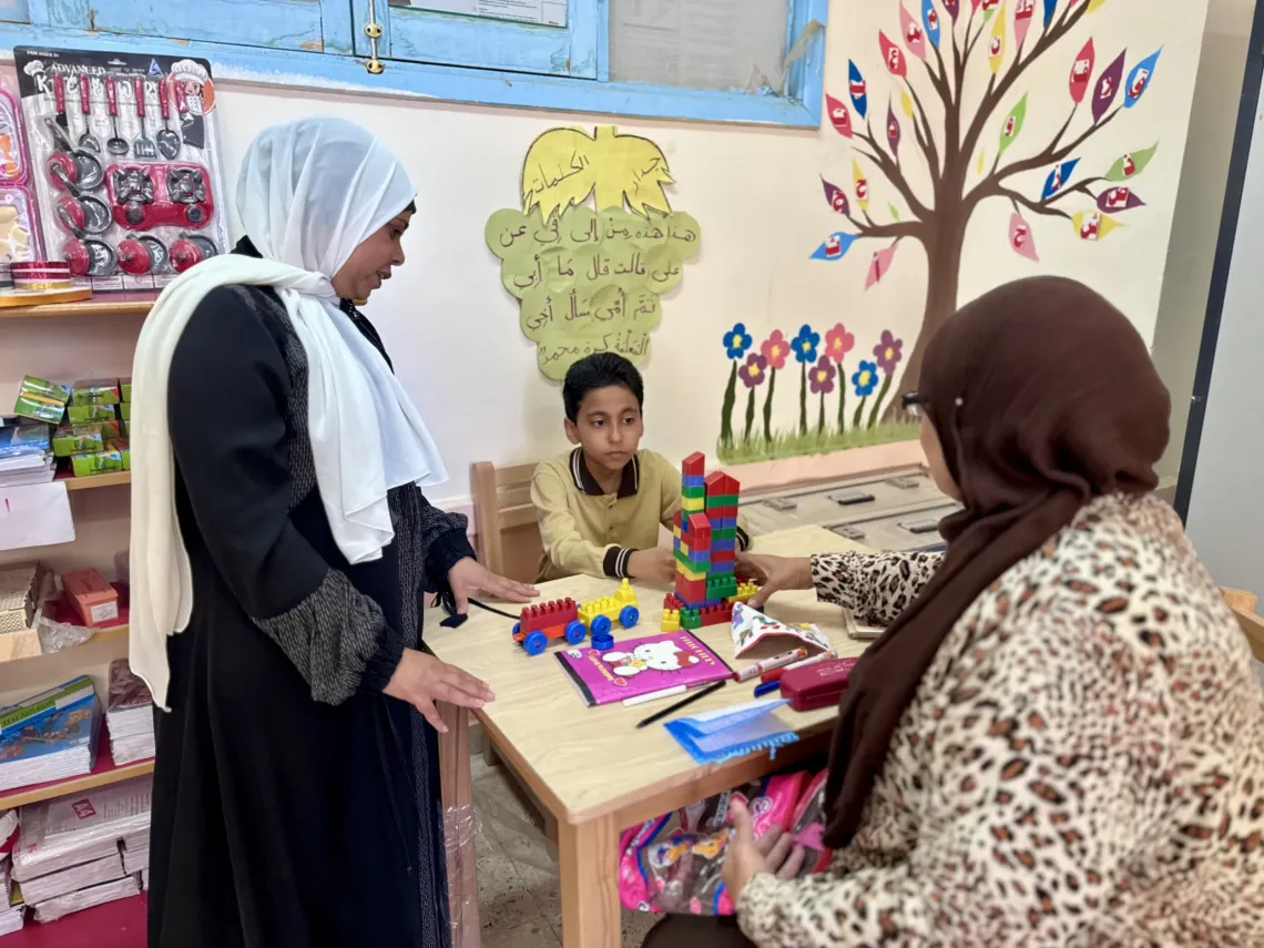 Mazen with his teachers