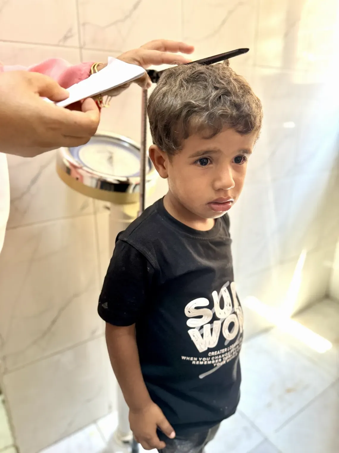 A child having his growth monitored to assess overall health and development