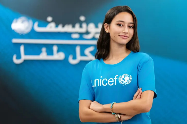 Lina Sophia posing in unicef tshirt
