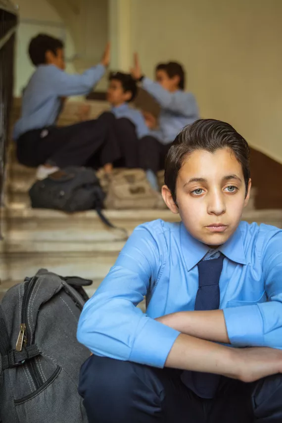 What are the warning signs of bullying?