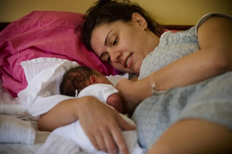 A woman breastfeeds her newborn at the KBC Zvezdara Maternity Hospital in Belgrade, the capital. A UNICEF-supported programme in the hospital teaches women how to care for their newborns, part of an effort to support families and prevent child institutionalization.