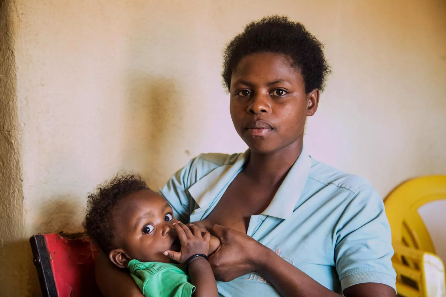 A mother breastfeeds her 4-month-old baby