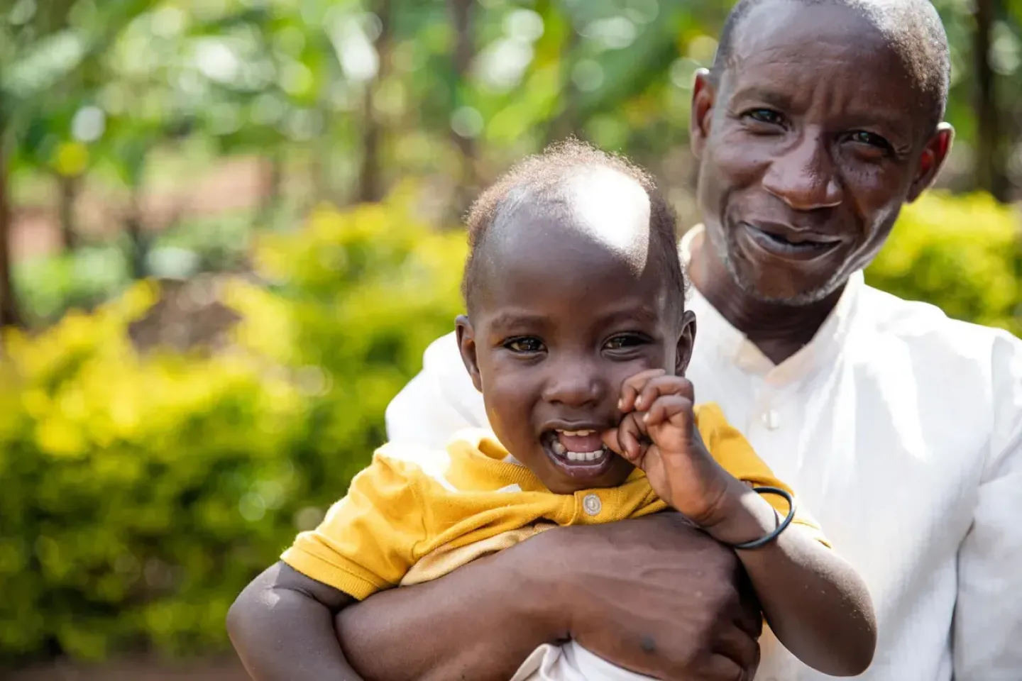A father and child smiling