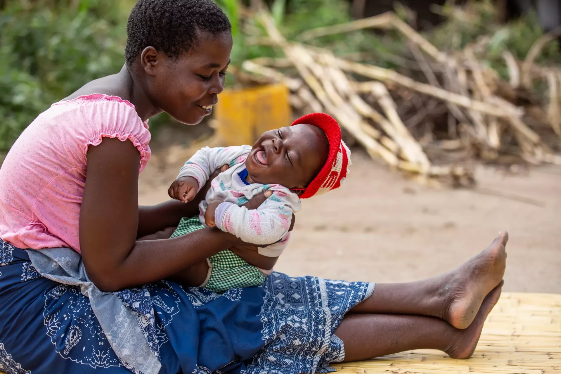 A woman holding a young child