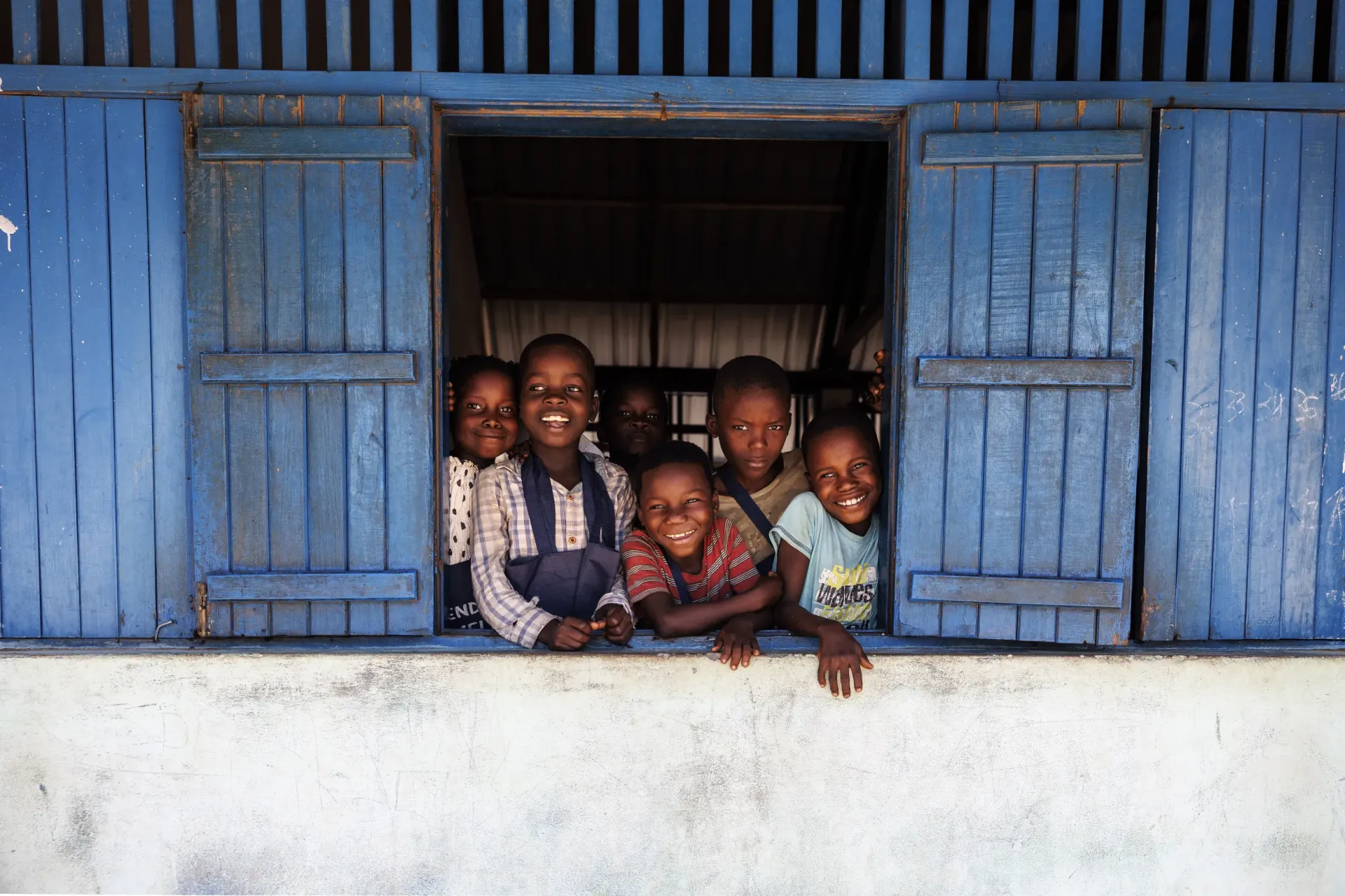 Children look out of a window