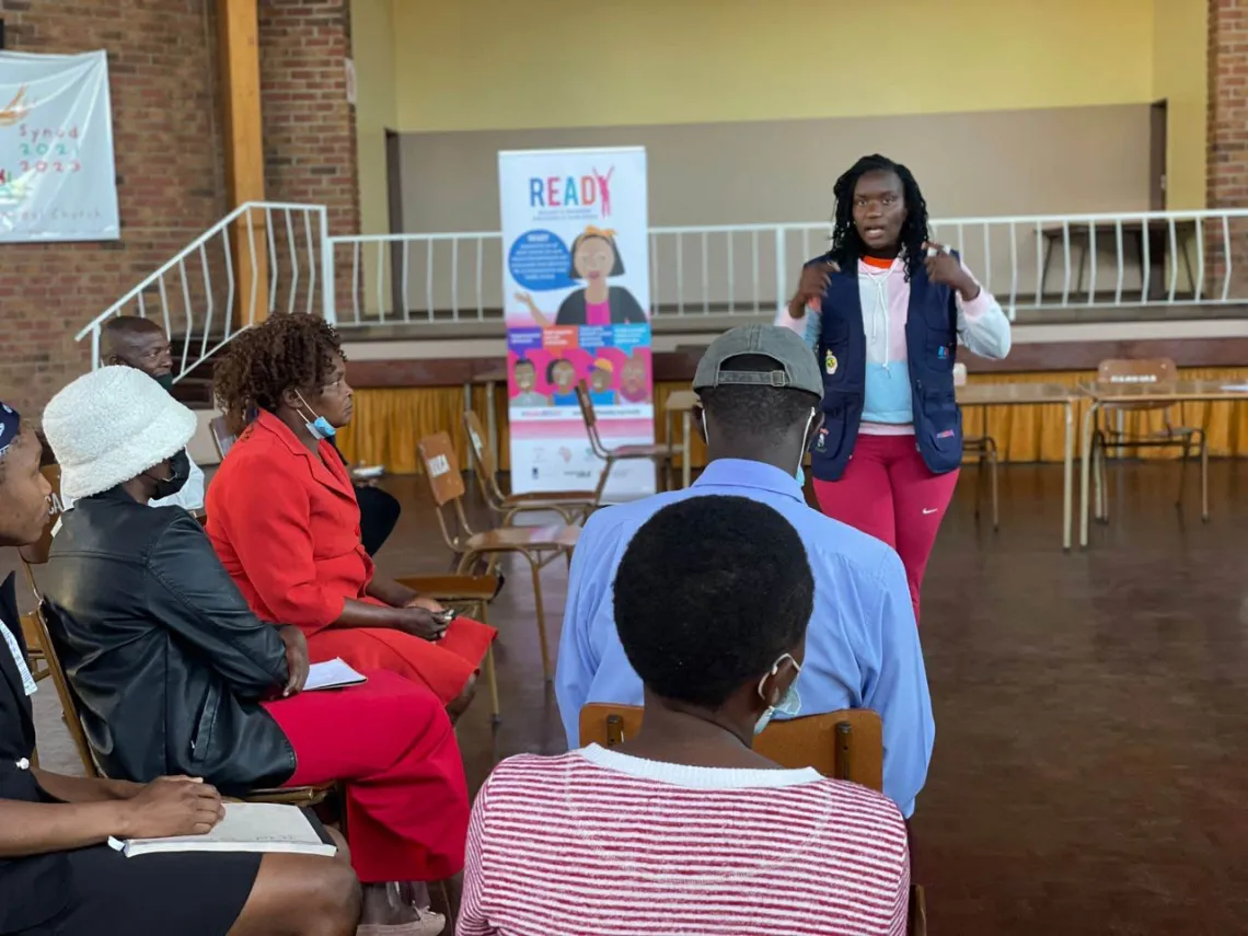 Ntombikayise Ncube facilitating a community meeting in Zimbabwe