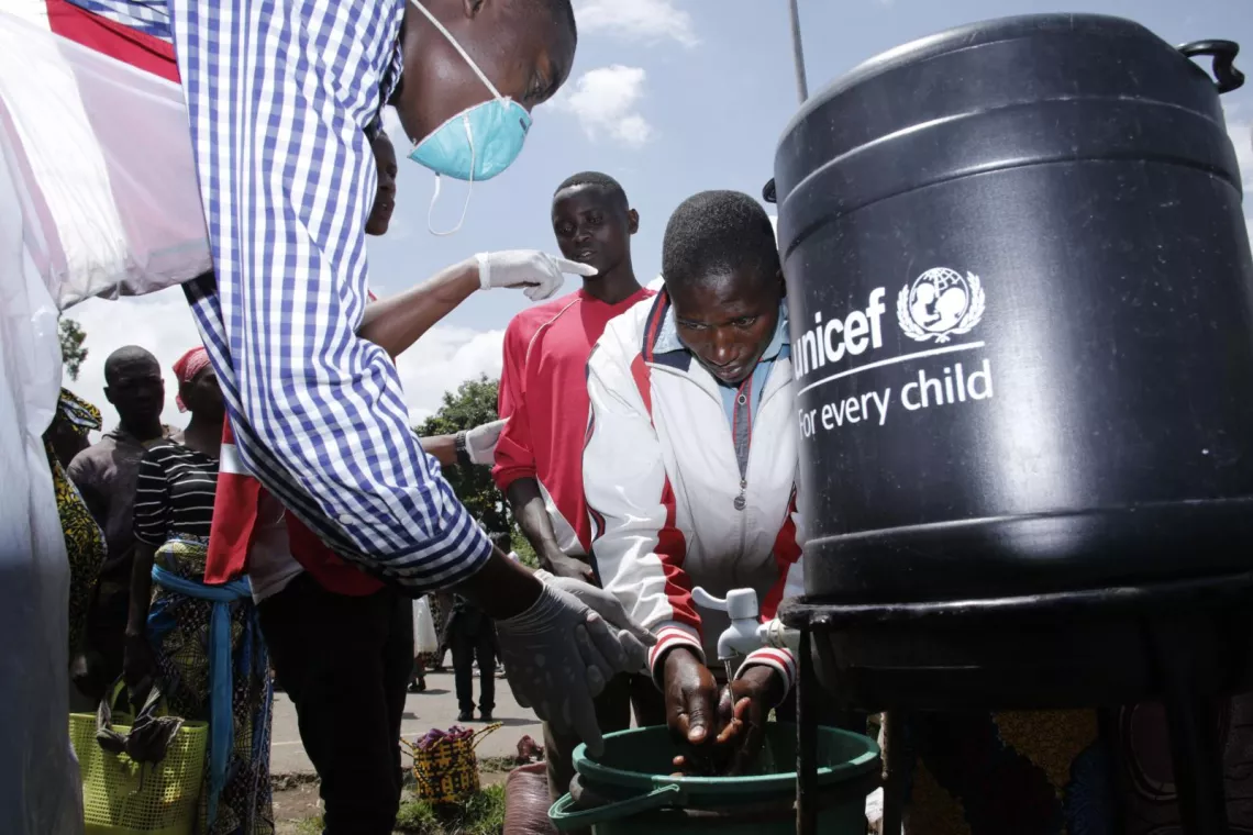 Handwashing at a UNICEF labeled water source