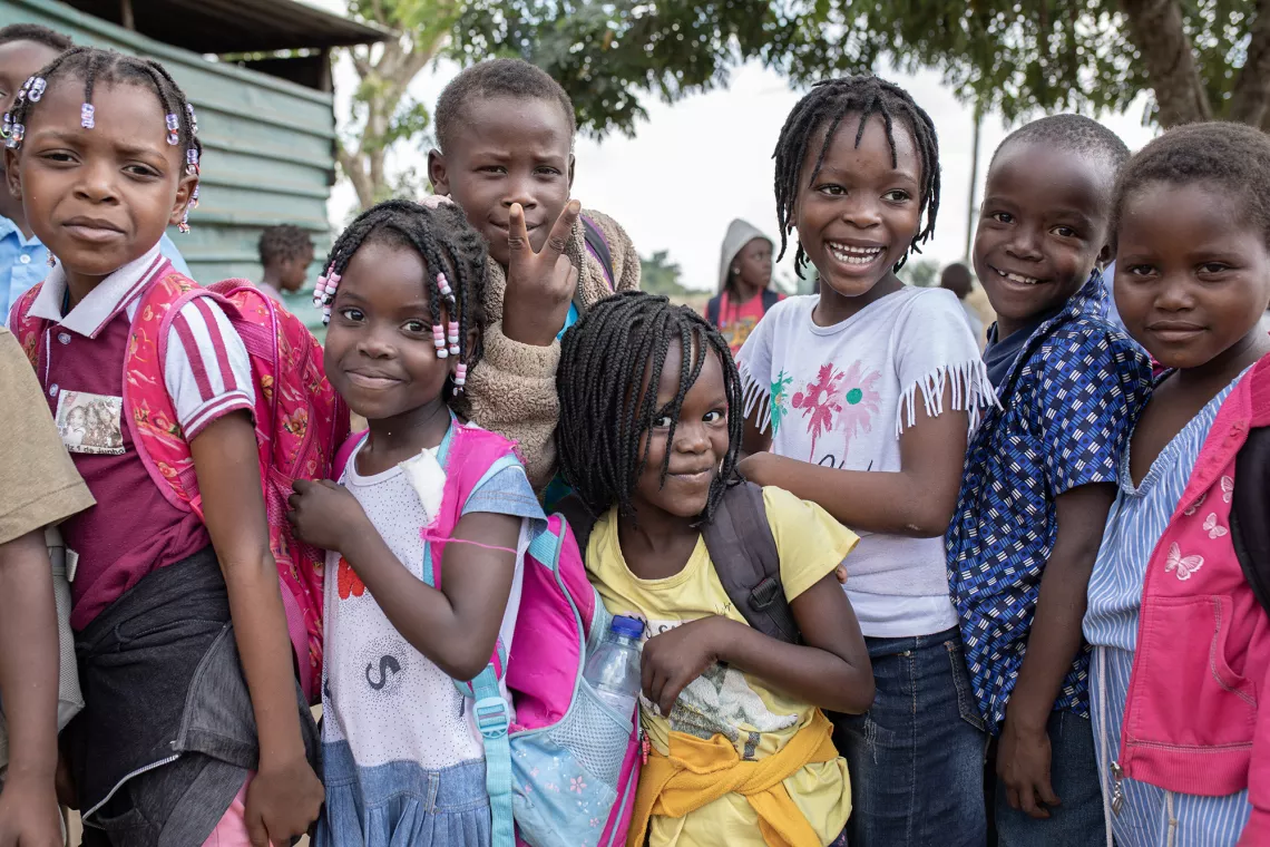 Children stand together for a portrait