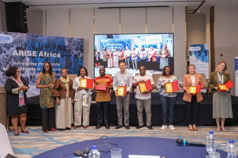 Stakeholders pose for a photo after agreeing on initiatives to end violence against children