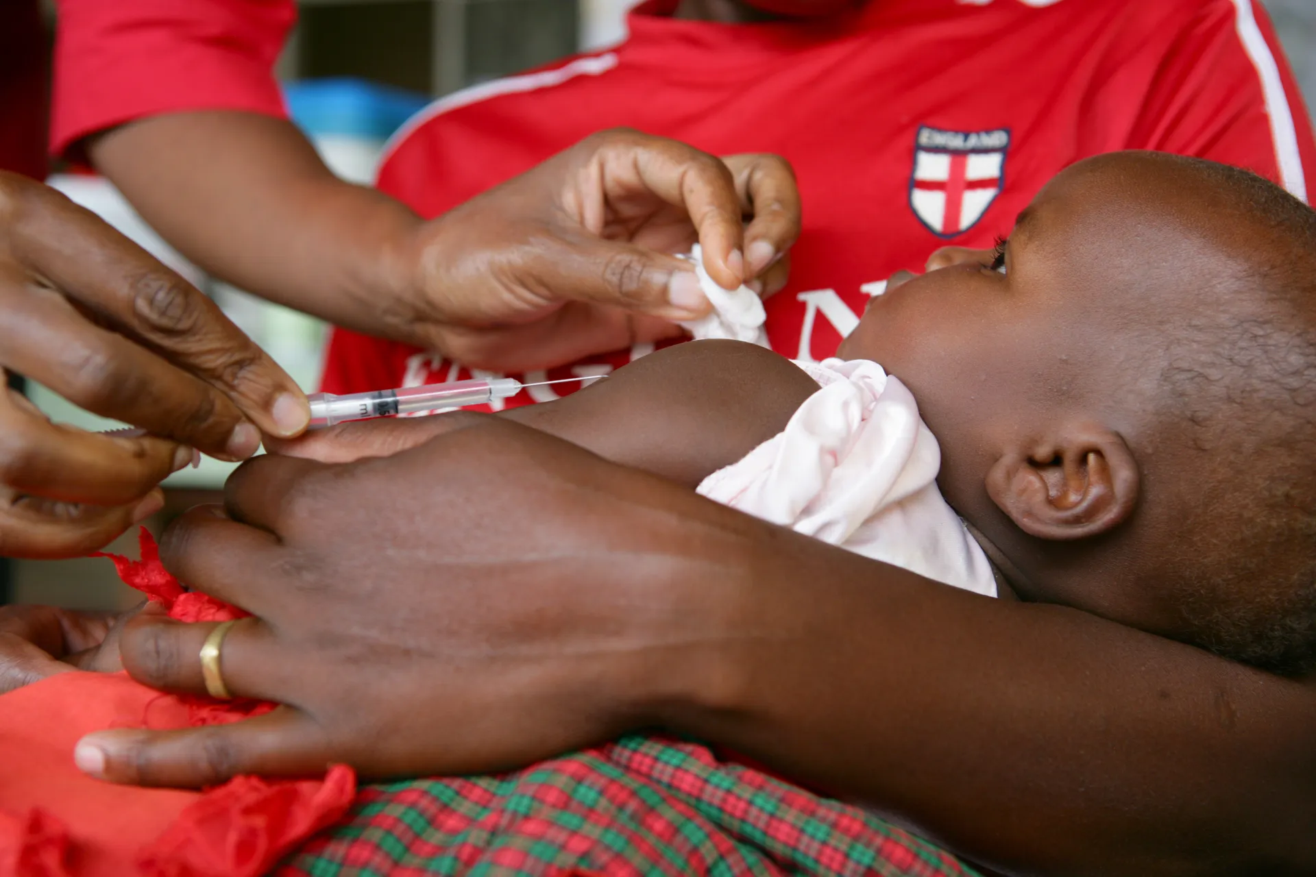 Baby getting vaccinated at a health center 