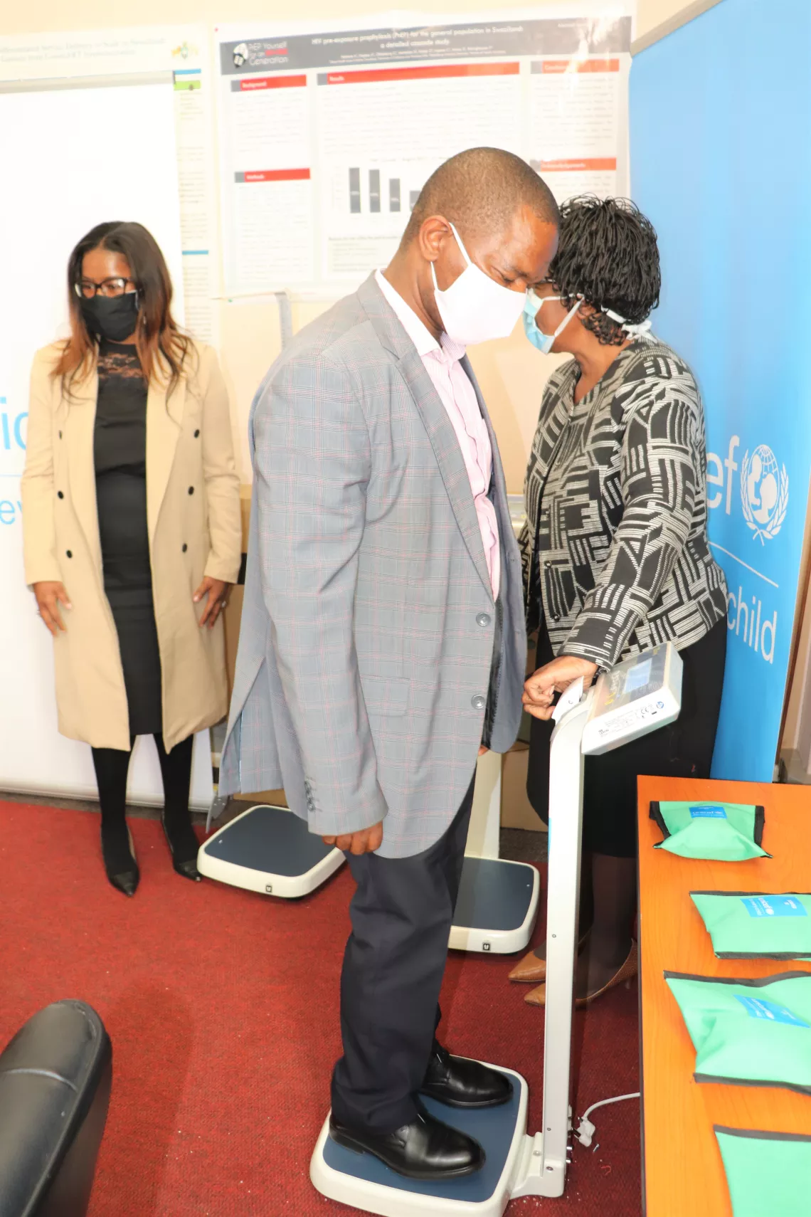A man standing on a digital weighing scale