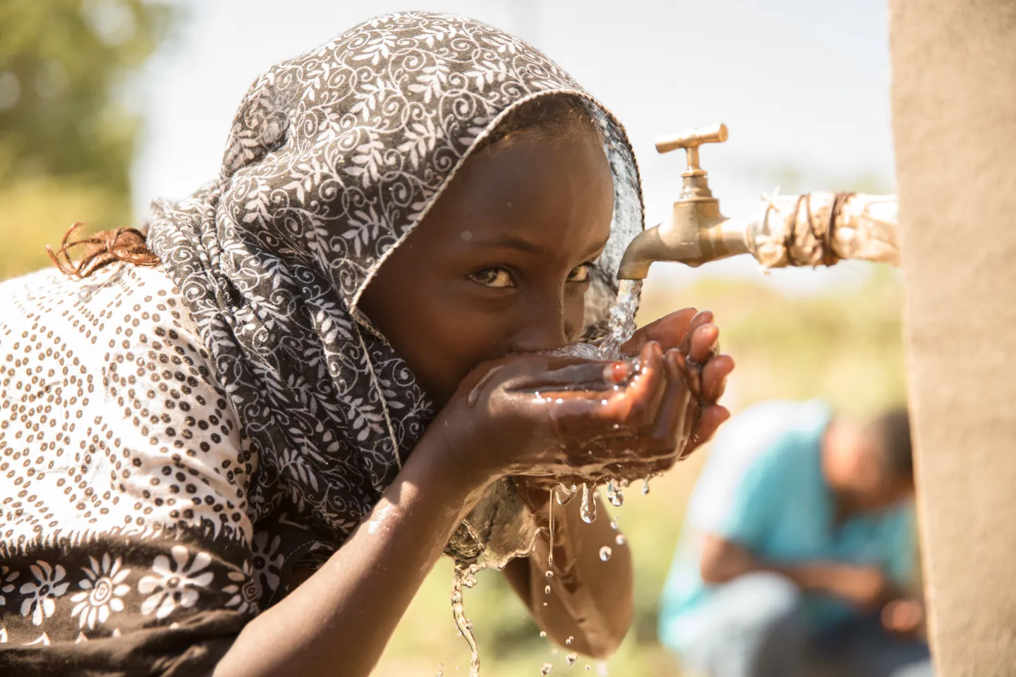 Girl from Afar drinking water 