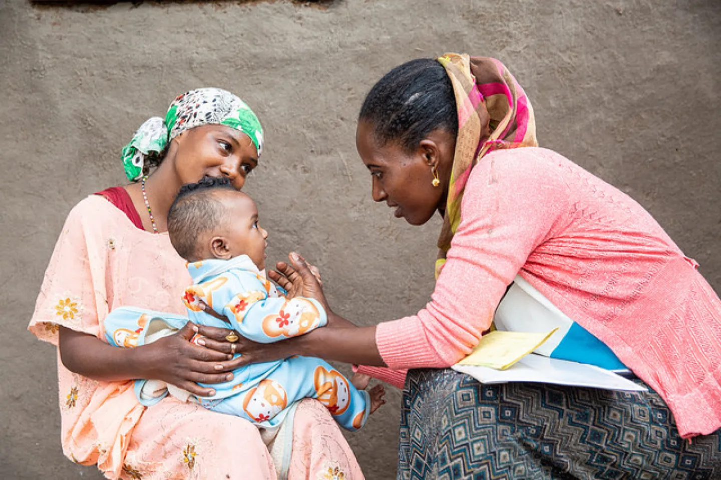 Amelework examines five months old Aziza. When Aziza was 45 days old, she suffered from Pneumonia. But now she is growing up healthy. 