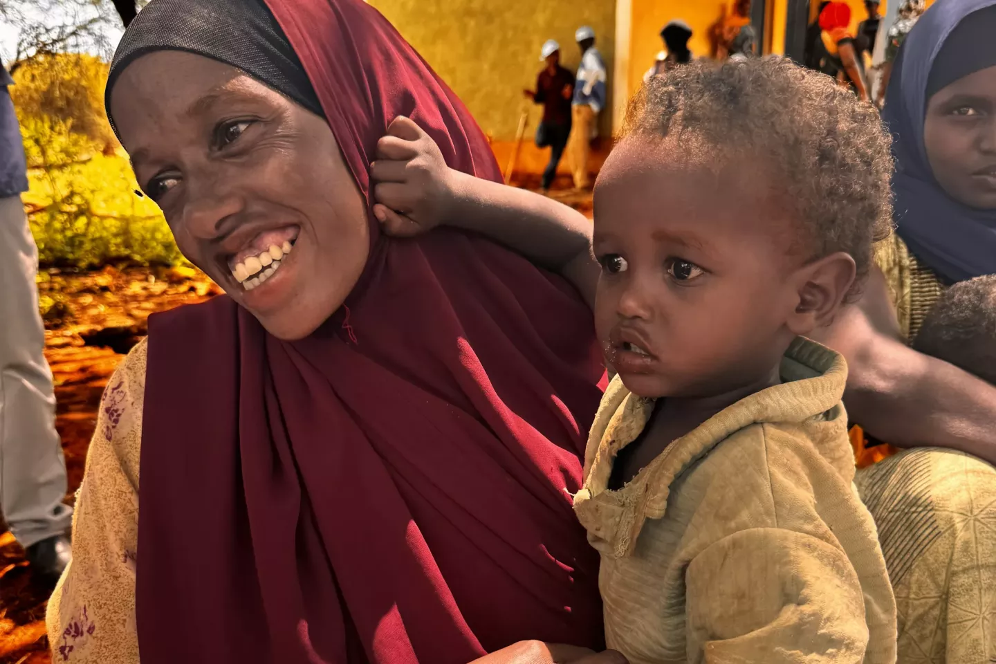 Asmah and her son at the health post. All three of her children have received lifesaving vaccines 