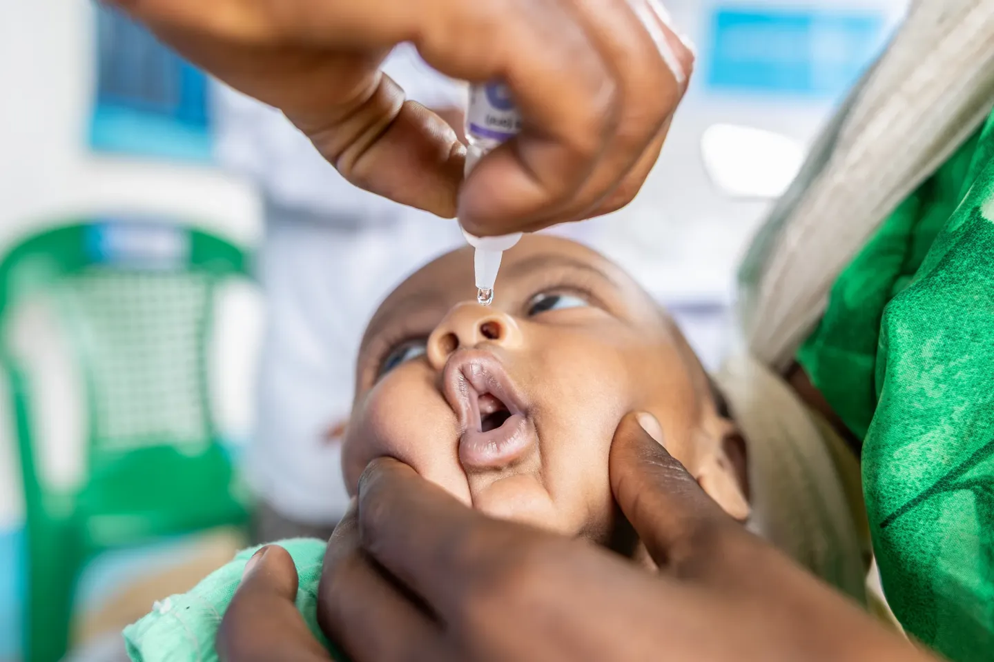 A ch=lose up shot of a child being vaccinated against polio. 