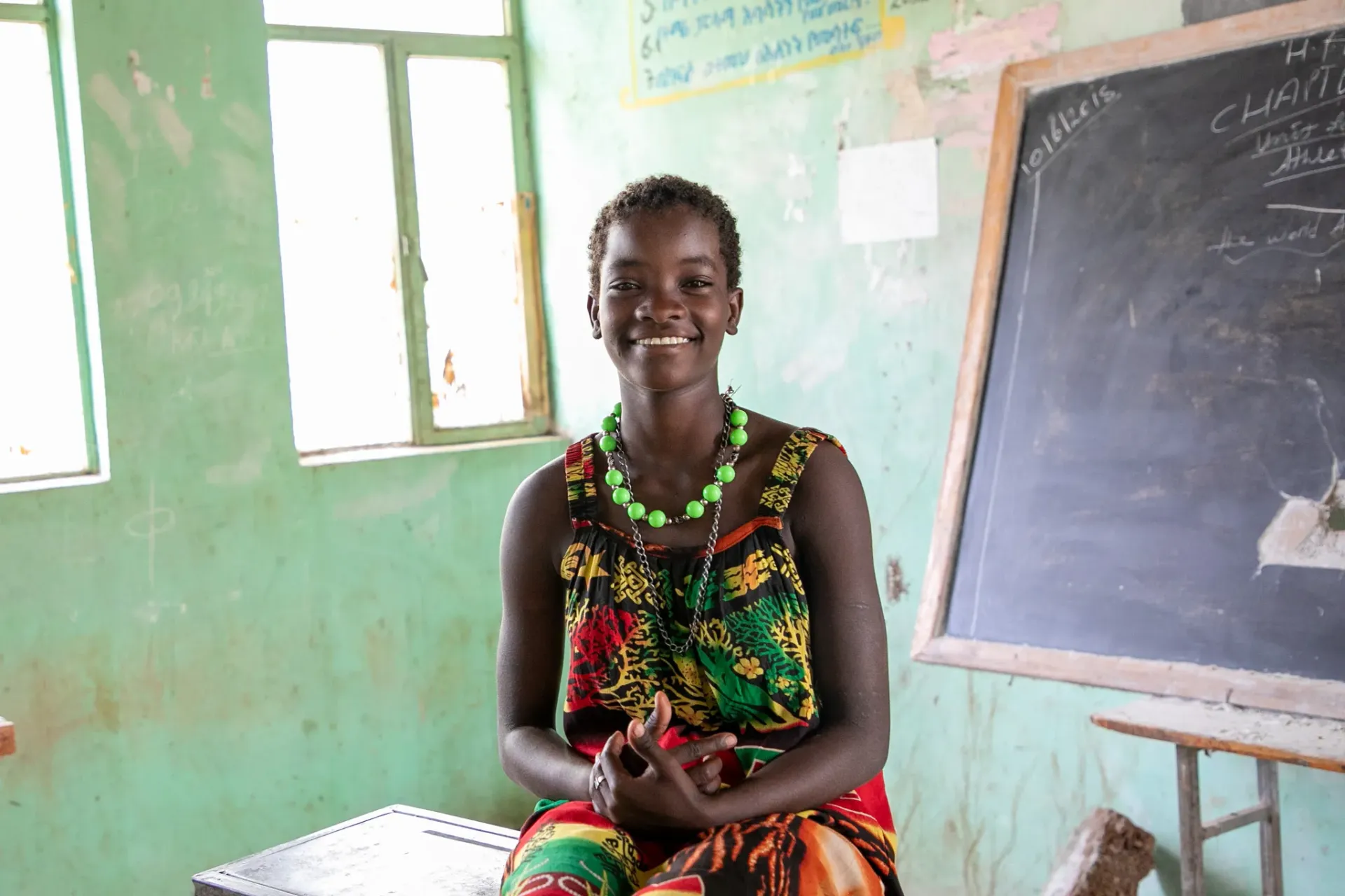 Haksa sitting in her classroom