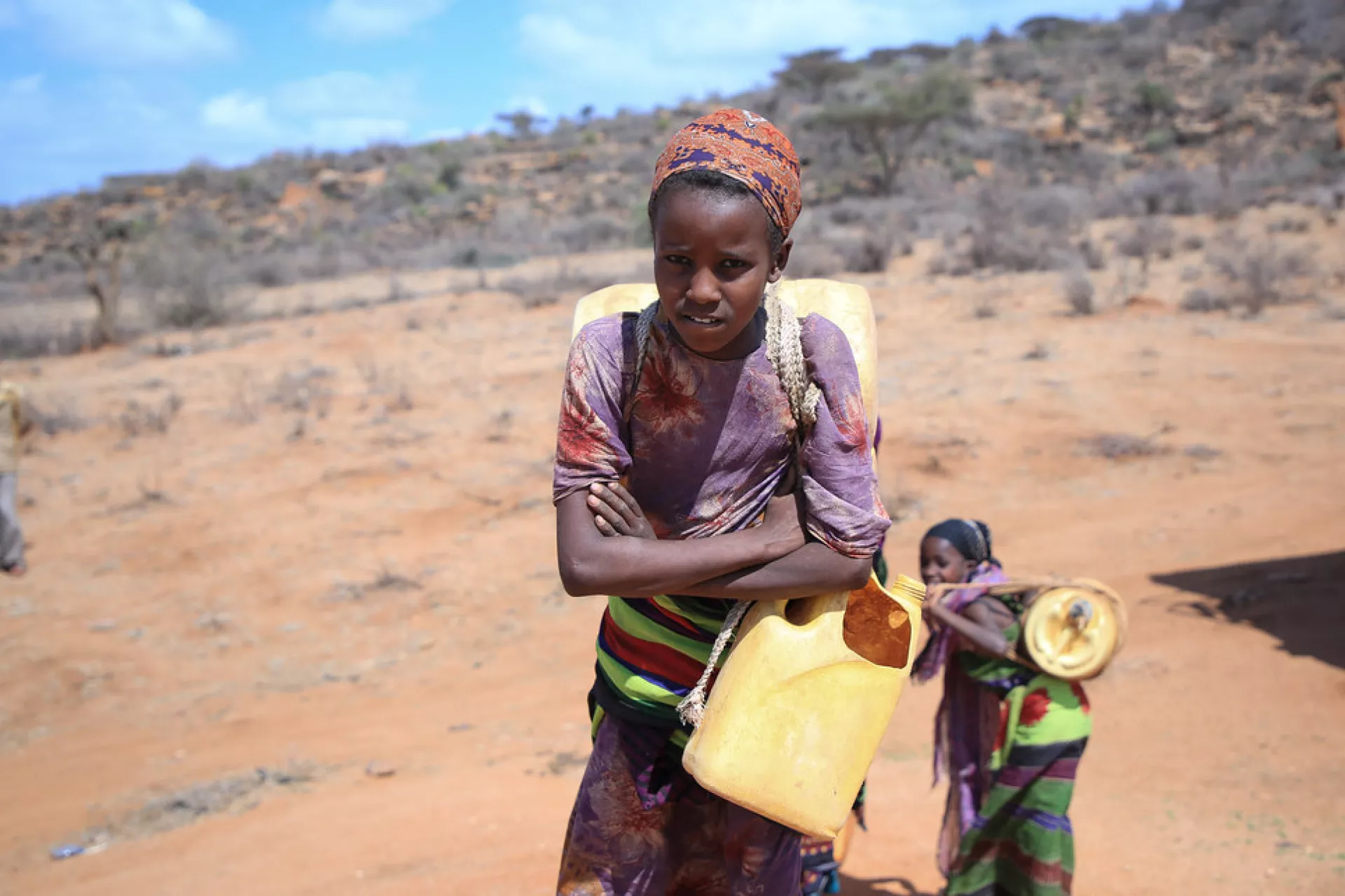 Adi Kure, 11, fetches water