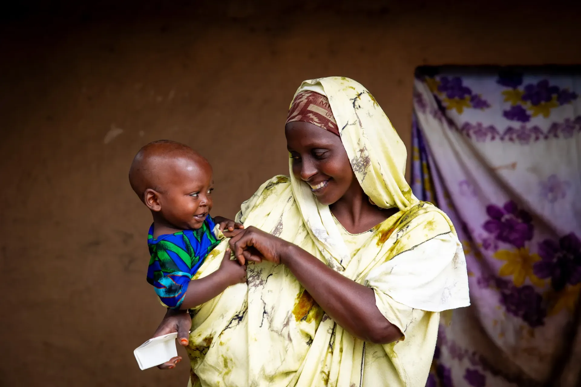 Teyiba holding her child