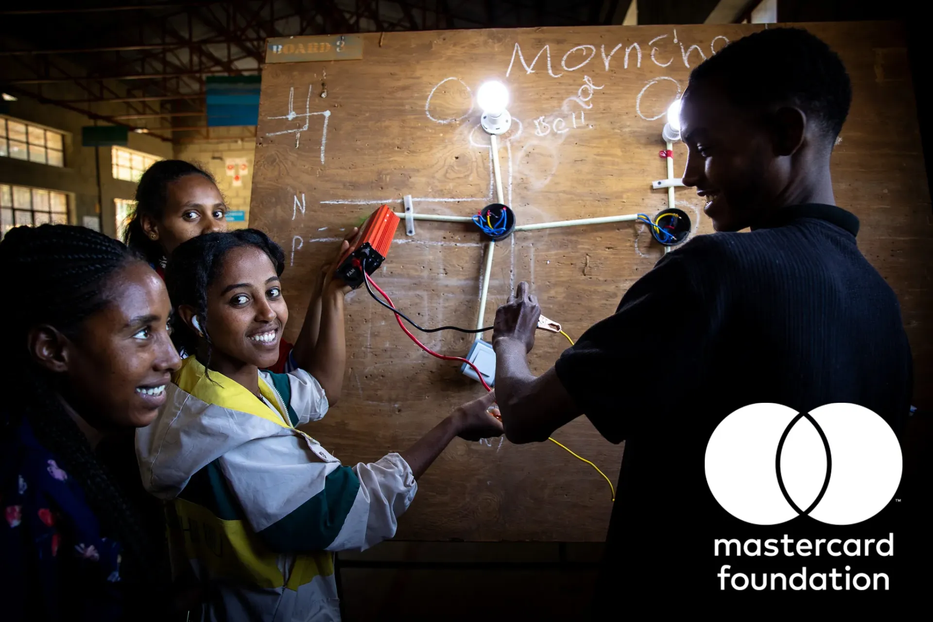 Particpants of the Biqu Wetat Programme working on solar light board