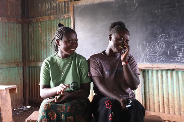 7th graders Meskerem and Bethlehem laughing their classrooms