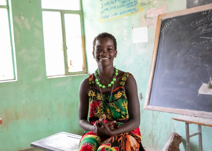 Haksa sitting in her classroom