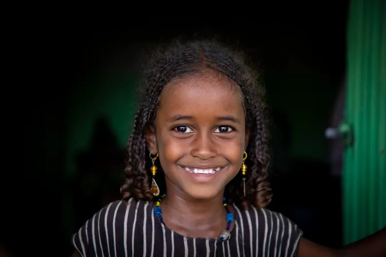 A little girl smiling