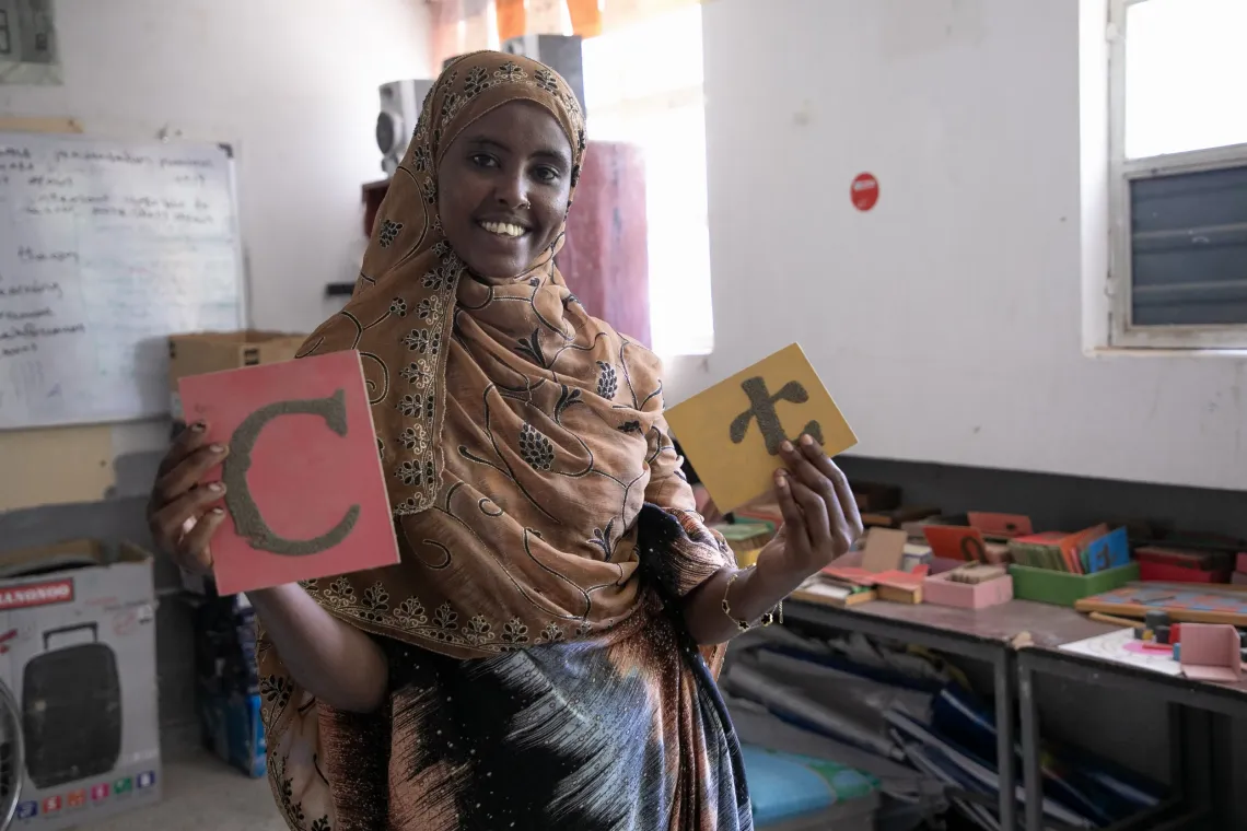 Hallo Abdulkader, 22, an ECDE student demonstrating an early childhood educational tool