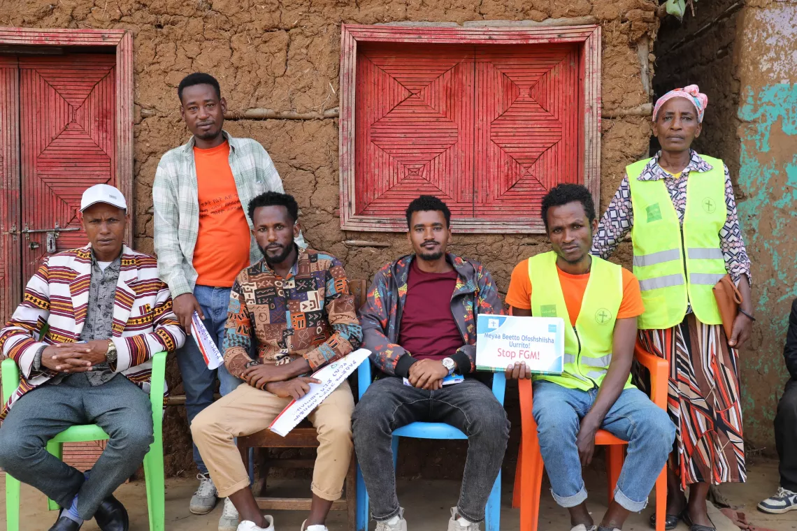 Social worker and volunteers sitting together at Derrara, Sidama region