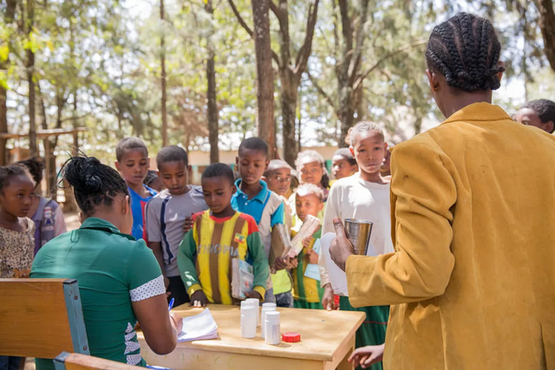 Students line up to receive deworming tablets at Gurumu Koysha Primary and Secondary School in the SNNP Region of Ethiopia. Deworming of adolescents became a national programme after being introduced through the Canada-funded project.