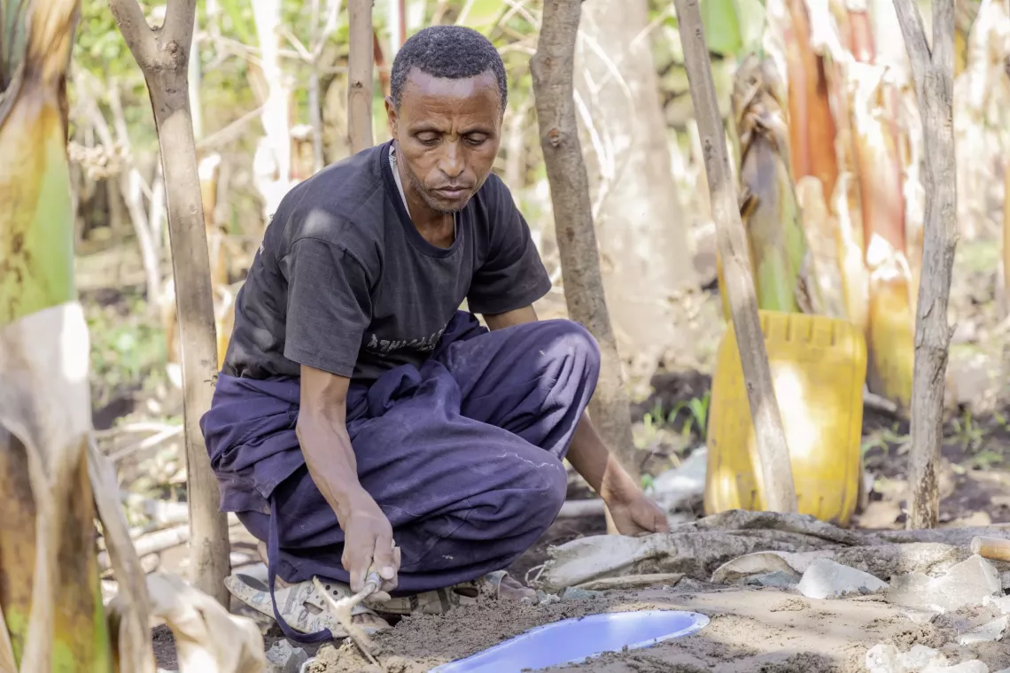 A young man working on Sato-installed concrete slabs 