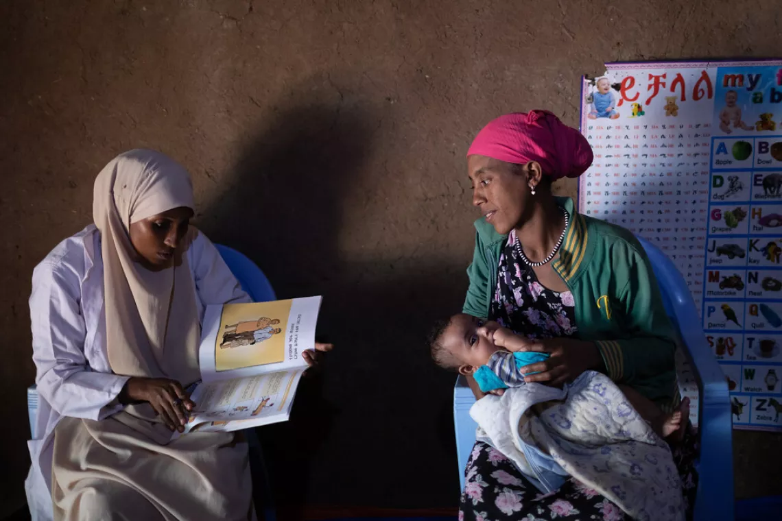 Health extension worker Hawa visits Lubaba Tilahun and her child Elham Mohammed as part of a postnatal follow-up