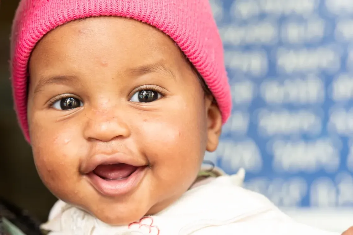 A little boy smiling at the camera
