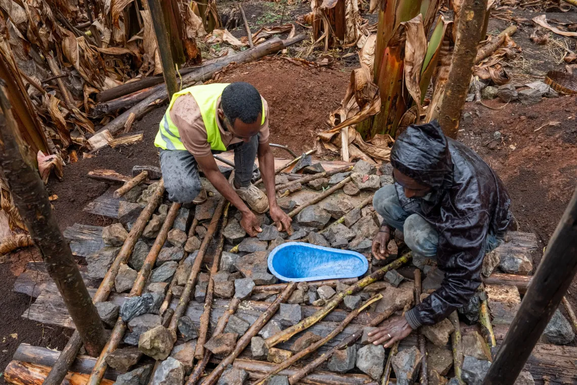 Two young man working on Sato-installed concrete slabs 