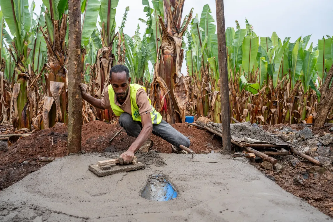 A young man working on Sato-installed concrete slabs 