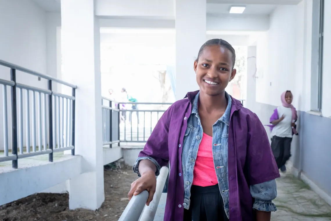14‑year‑old Biruktawit Tamirat standing in the hallway of her school