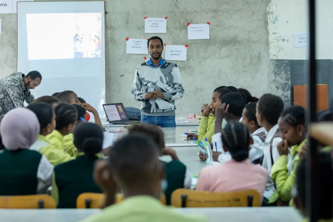 A social worker teacher student in a classroom