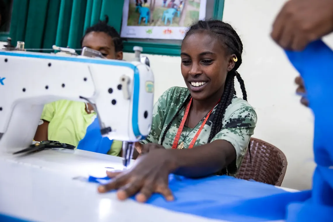 Tirhas, 29, using her sowing machine at the Biqu Wetat training center. 
