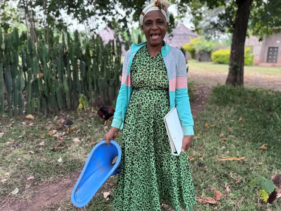 A women holding Sato Pan product in her hand and posing for the camera