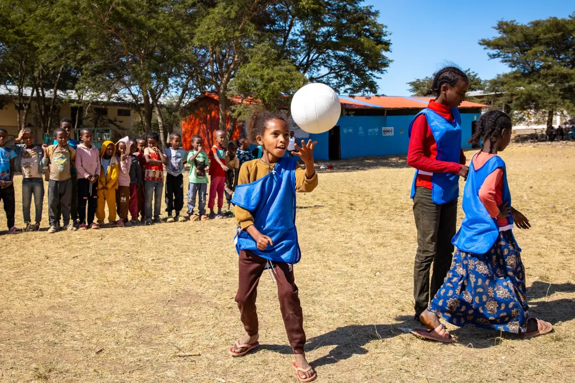 Adiam playing volleyball with her classmates. 