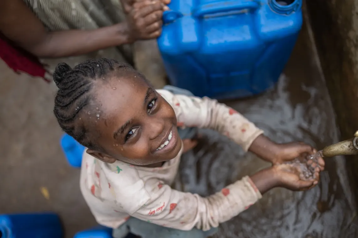 A little girl at a water point
