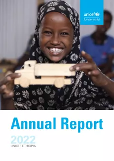 A girl child playing with a toy car  