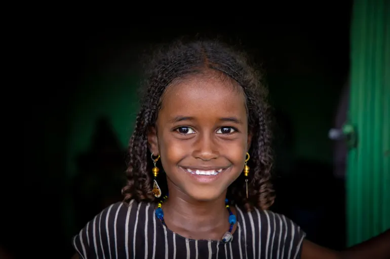 A little girl smiling