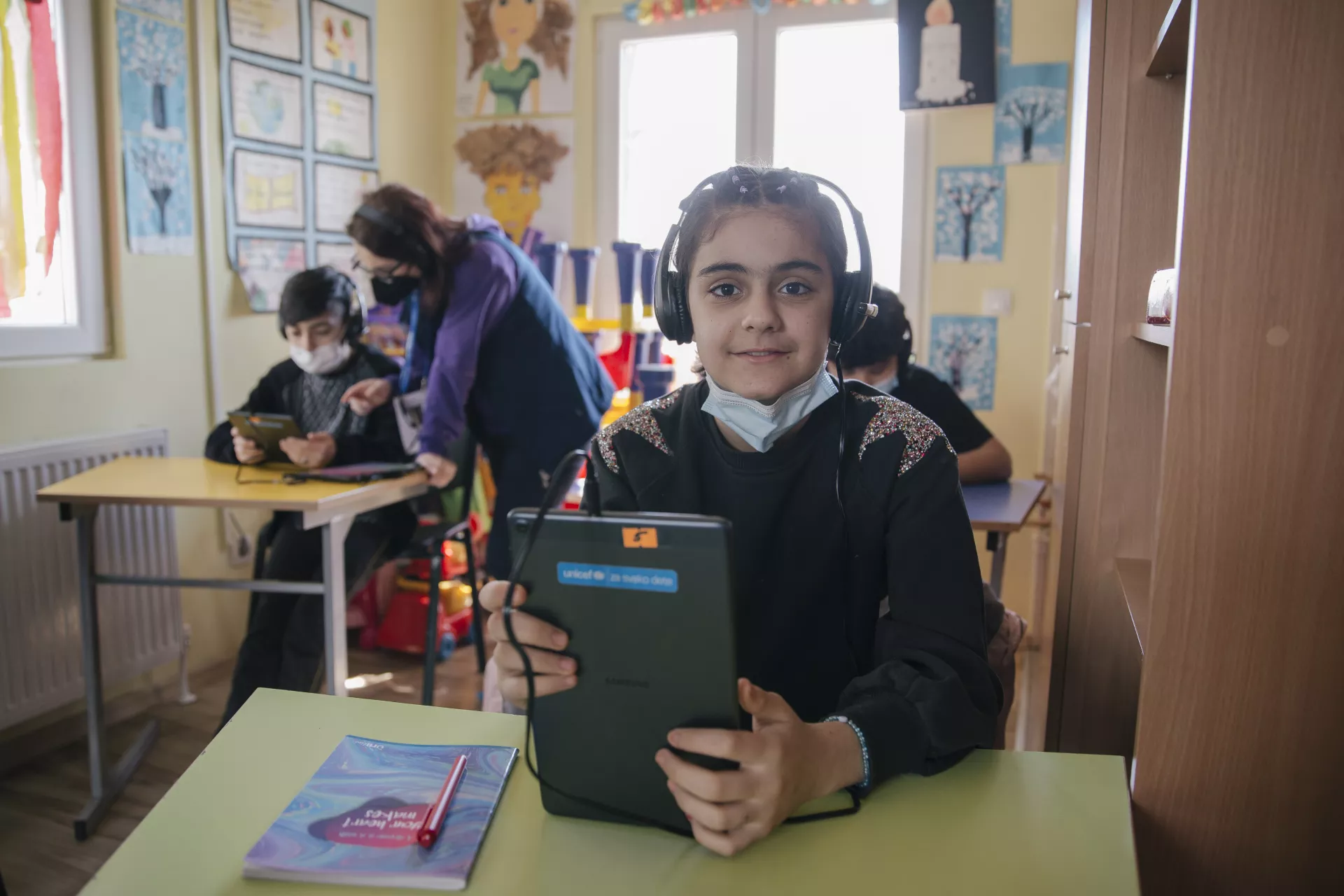 Girl is attending the centre to continue her education during COVID-19 pandemic.