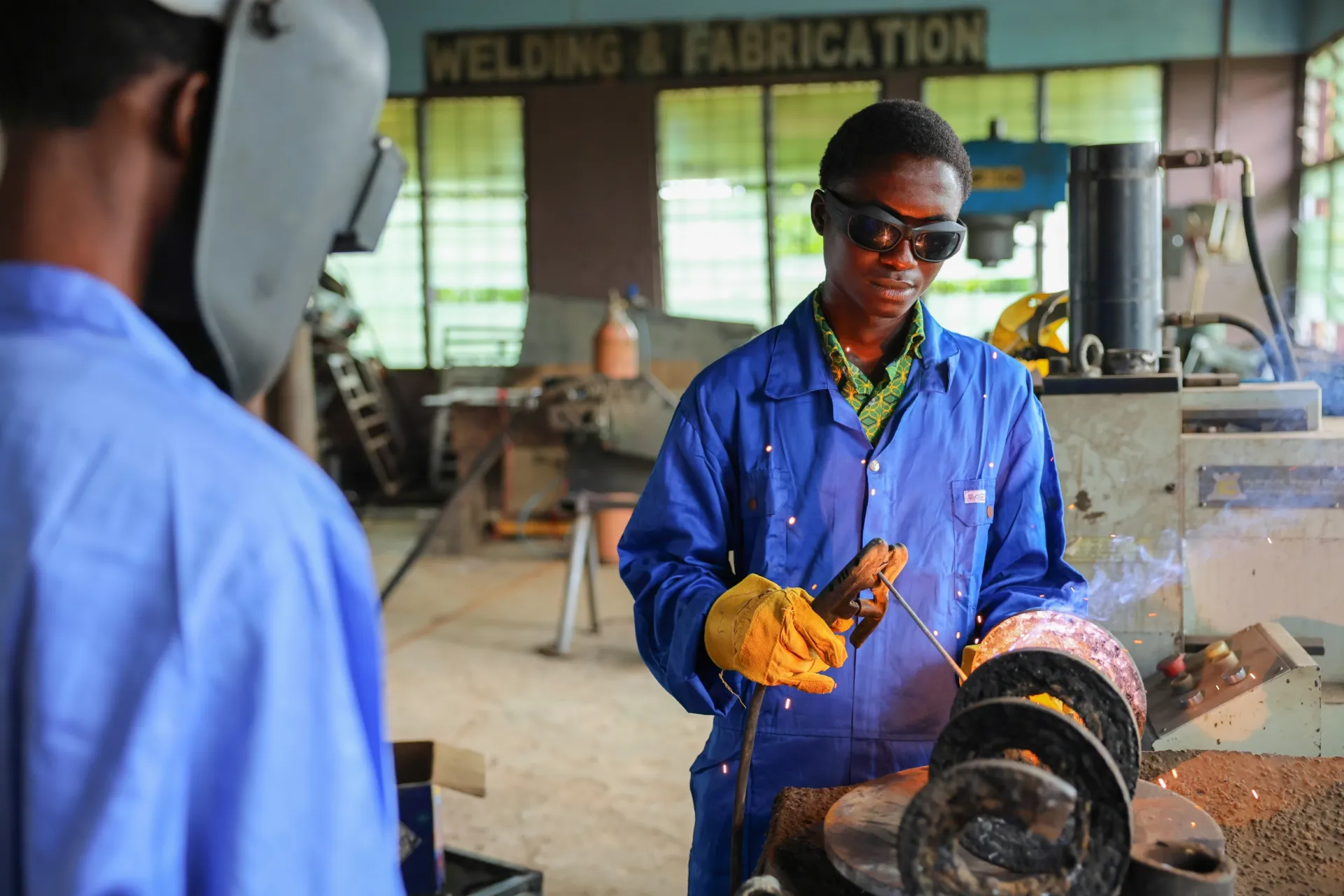 Students welding at a TVET institution in Ghana