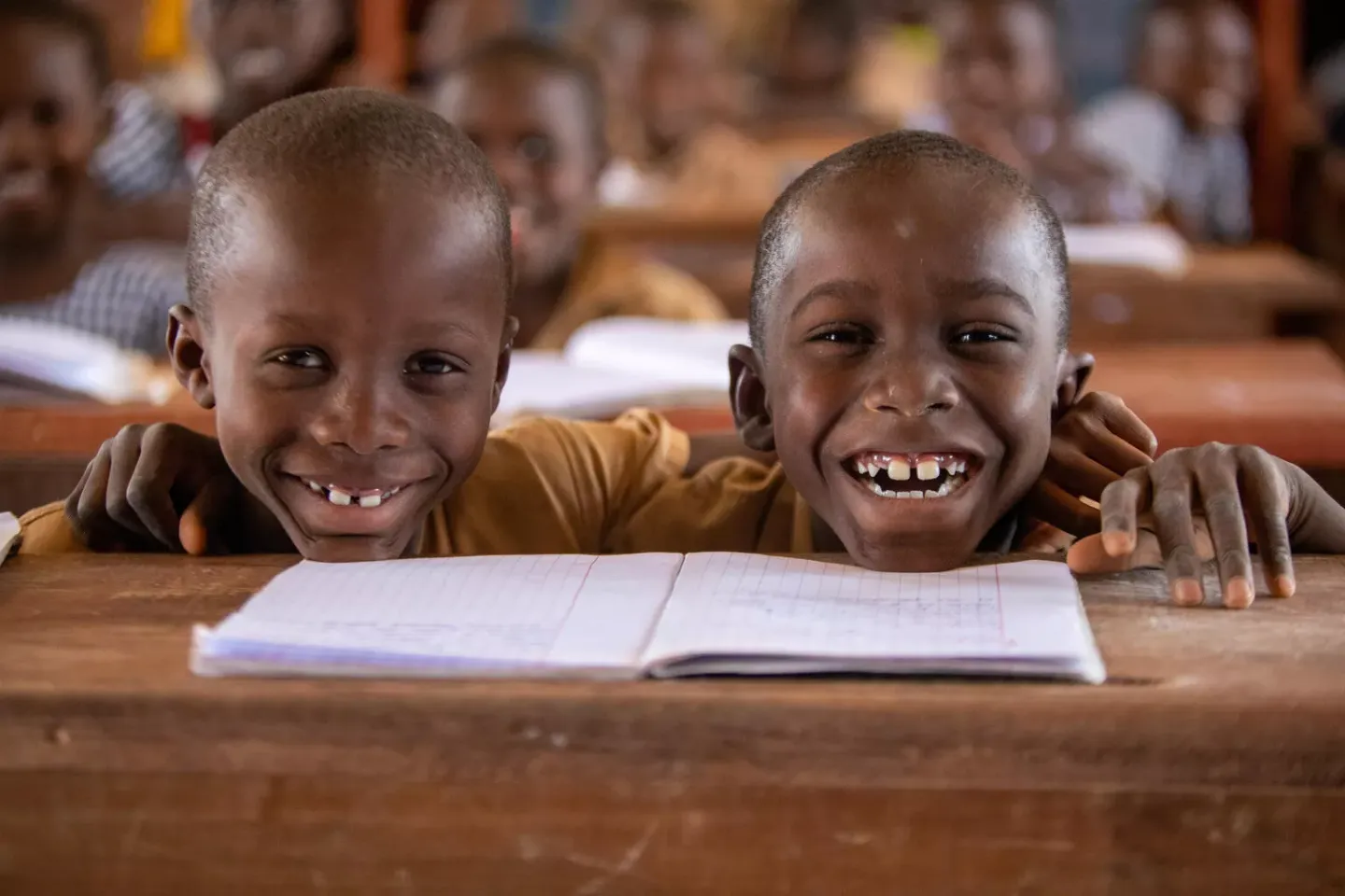 Twins Jaures and Emmanuel, both 7, attend class in Odi&eacute;nn&eacute;, western C&ocirc;te d'Ivoire.